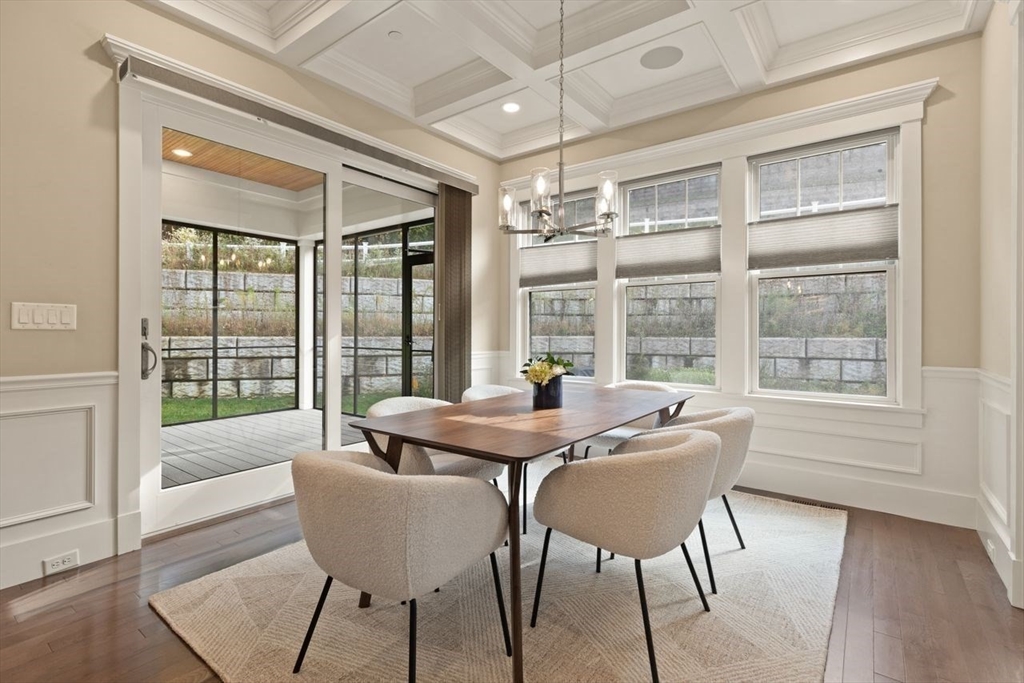 5 Gershon Way, Unit 5 Winchester, MA 01890 - Photo 10 of 27 a dining room with furniture a chandelier and wooden floor