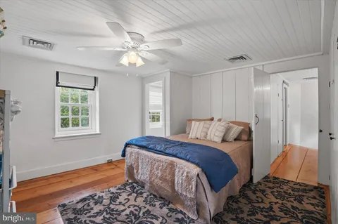 a bedroom with bed and a window