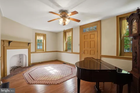 a view of a livingroom with furniture window and wooden floor