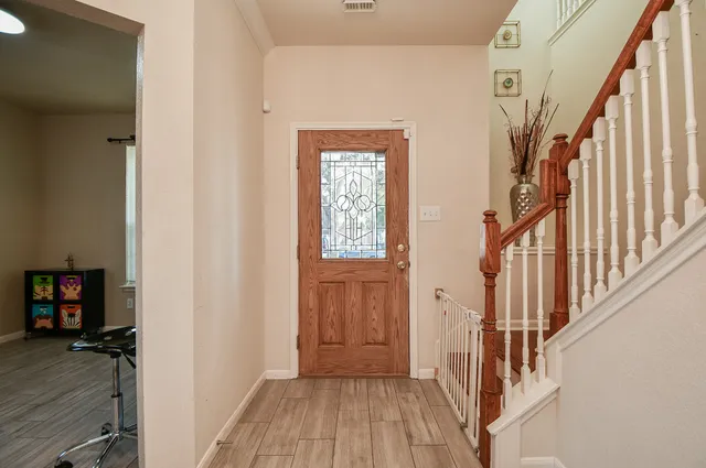 a view of front door with stairs
