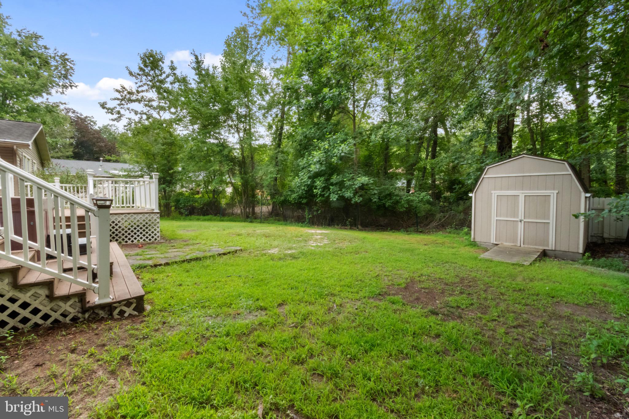 51 Christopher Mill Road Medford, NJ 08055 - Photo 23 of 24 Spacious backyard oasis with lush greenery.