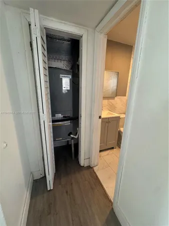 a bathroom with a granite countertop shower and a toilet