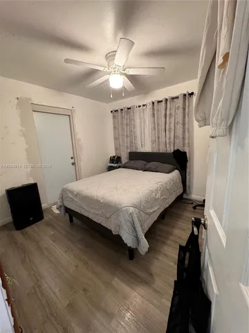 a bedroom with a bed and a walk in closet
