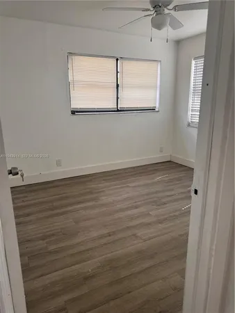 a view of lot of wooden floor and window
