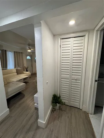 a large bed sitting in a bedroom next to a window