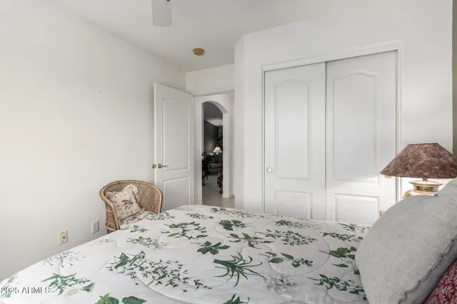 a bedroom with a bed and a dresser