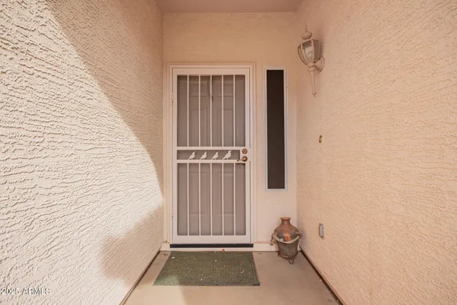 a view of a door and a window