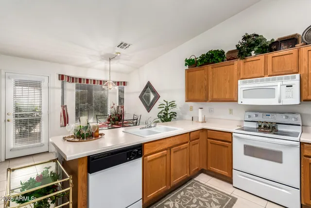 a kitchen with a sink stove and microwave