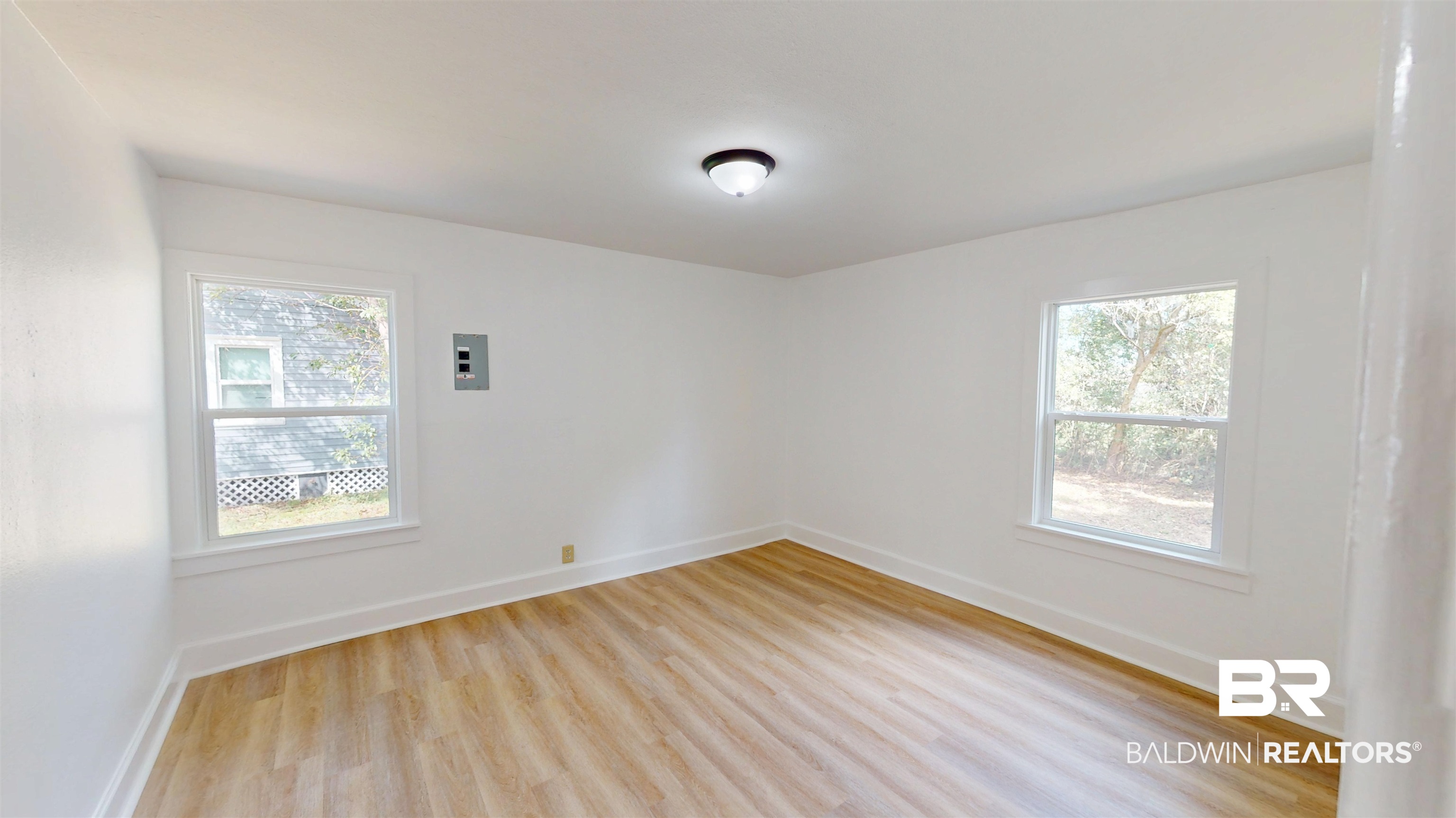 606 Shady Oak Drive Mobile, AL 36608 - Photo 8 of 14 Spare room featuring light wood-style floors and baseboards