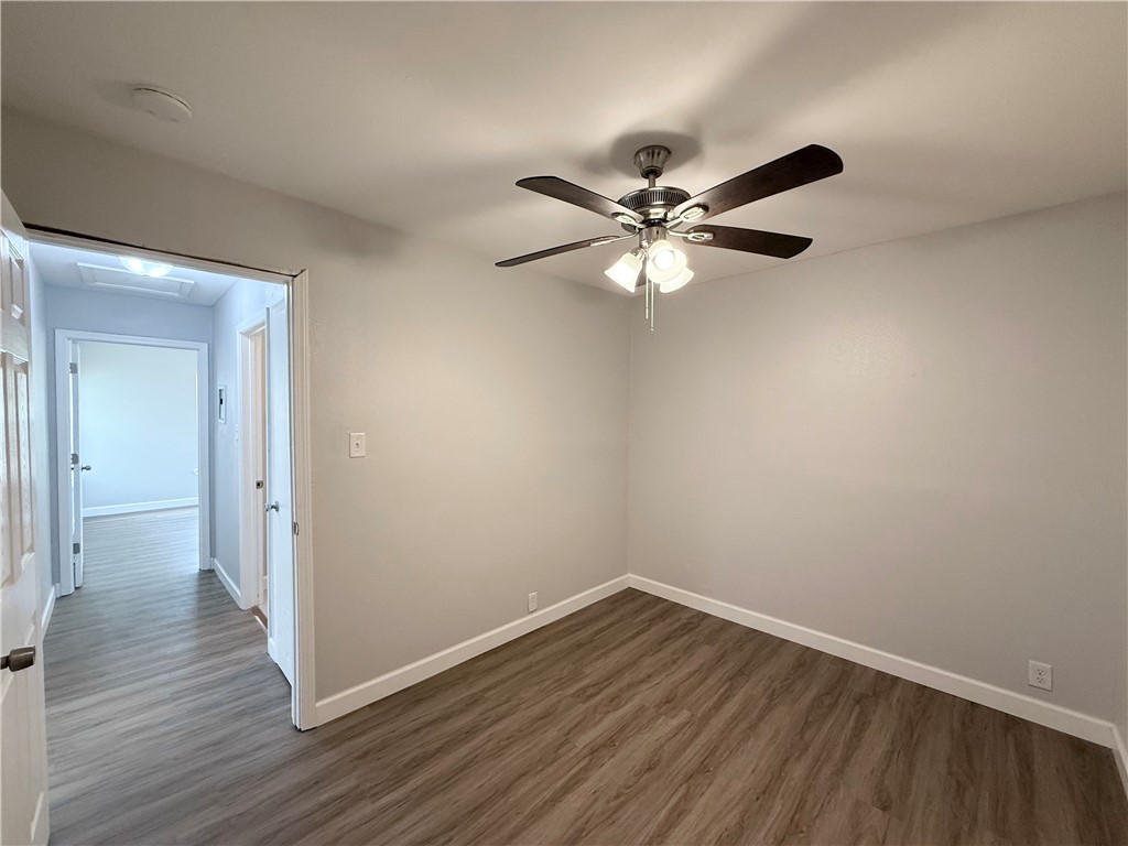 4814 Easter Drive Corpus Christi, TX 78415 - Photo 17 of 19 wooden floor in an empty room with a window