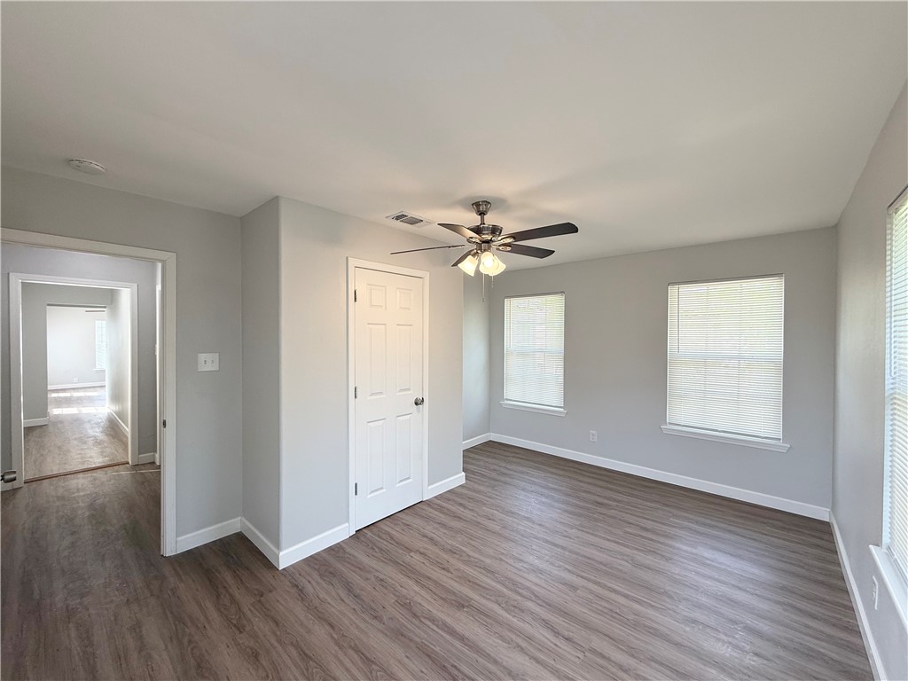 4814 Easter Drive Corpus Christi, TX 78415 - Photo 10 of 19 a view of empty room with wooden floor and fan
