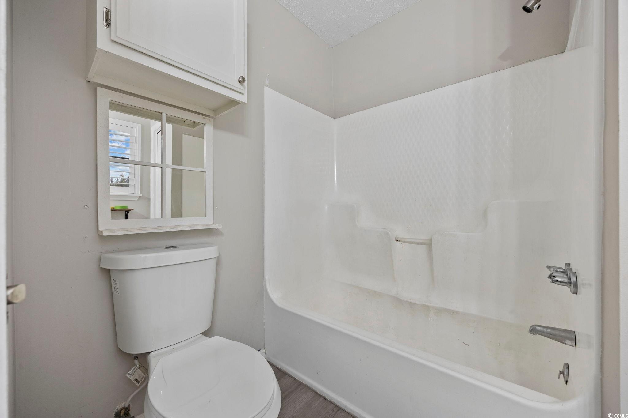 5180 Graham Street Loris, SC 29569 - Photo 16 of 28 Bathroom with bathing tub / shower combination and toilet