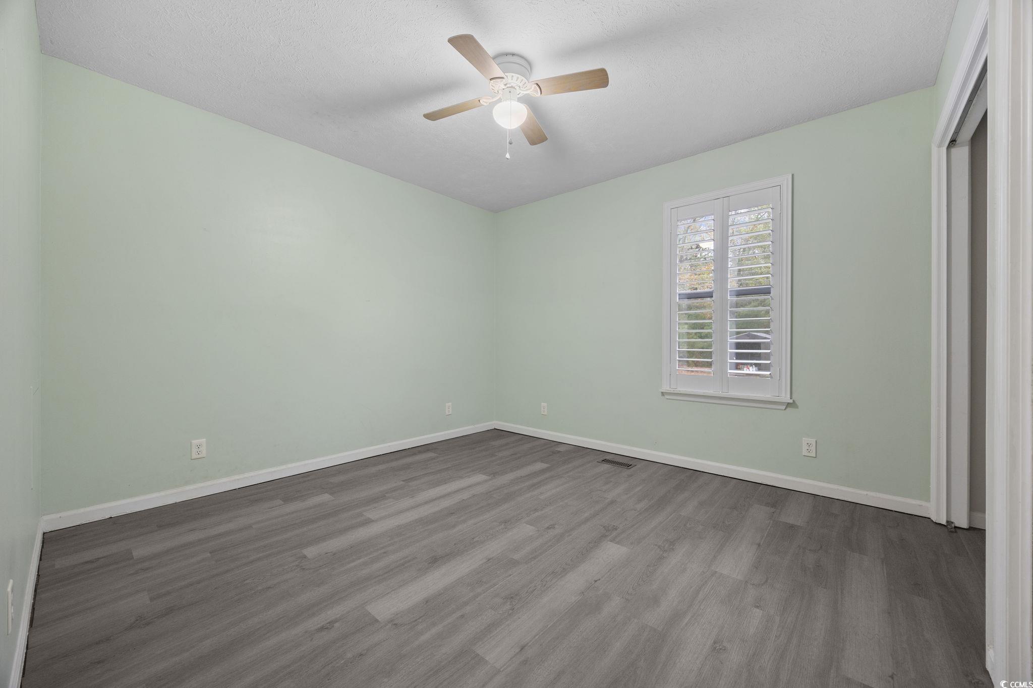 5180 Graham Street Loris, SC 29569 - Photo 20 of 28 Full bath featuring vanity, shower / washtub combination, and dark wood-type flooring