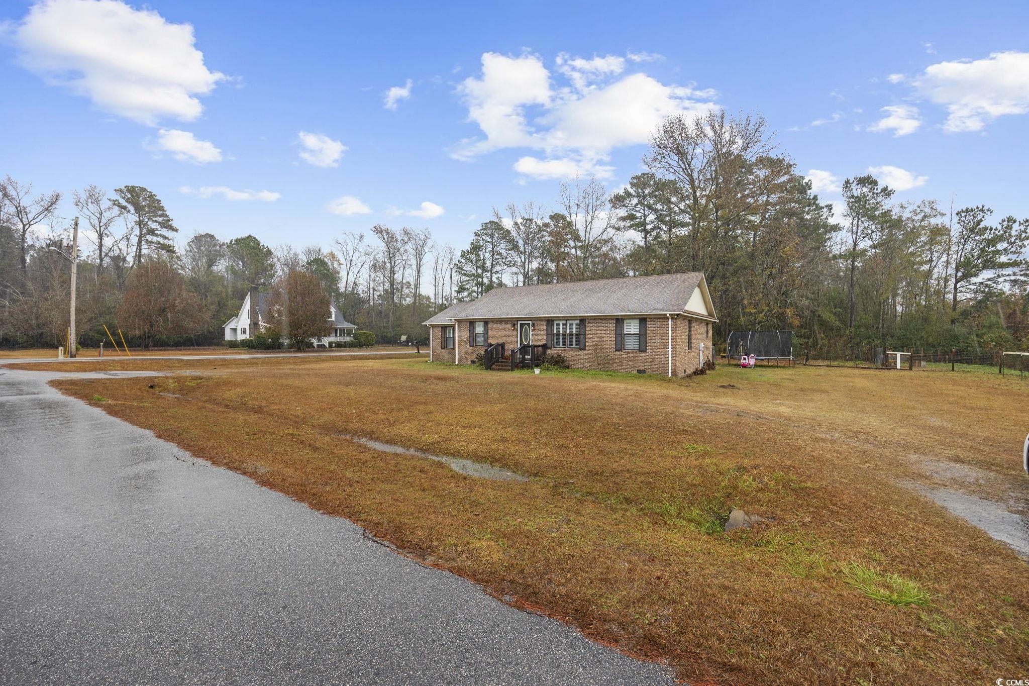 5180 Graham Street Loris, SC 29569 - Photo 3 of 28 View of front of home featuring a front lawn and brick siding