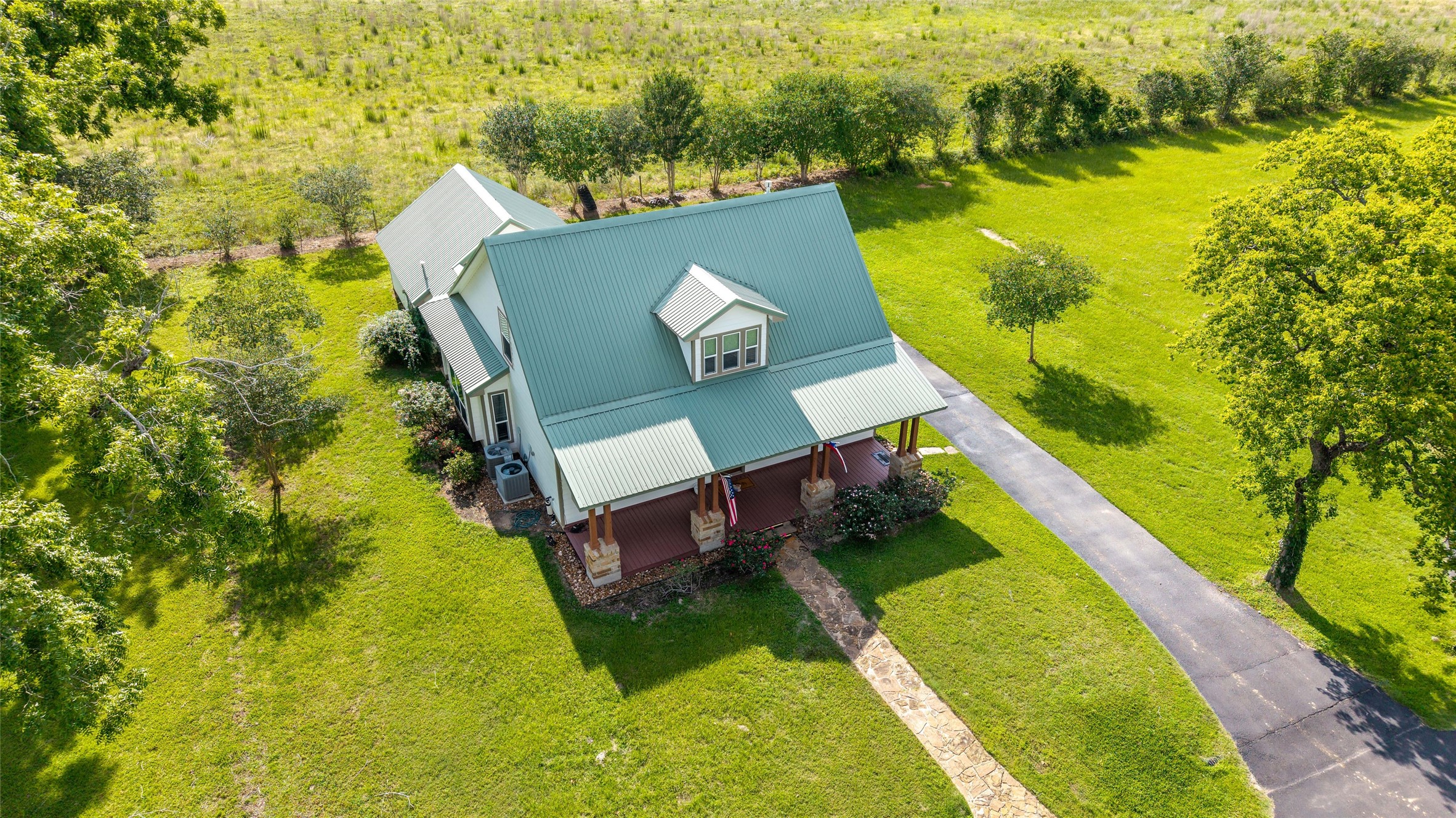 26631 Decker Prairie-Rosehill Road Magnolia, TX 77355 - Photo 8 of 20 a view of a swimming pool with a lake view