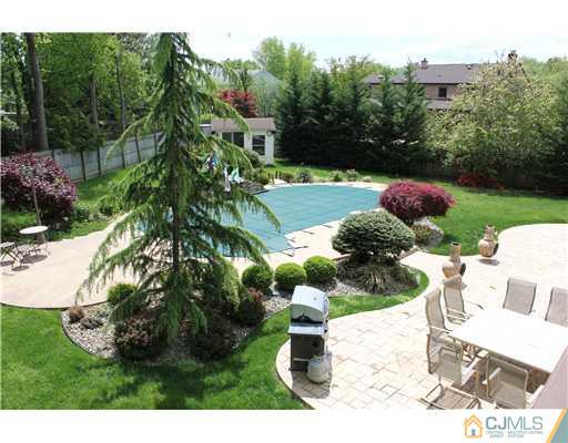 19 Pine Ridge Drive Edison, NJ 08820 - Photo 22 of 25 a backyard of a house with lots of green space