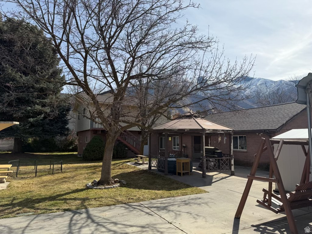 415 East Maple Street Mapleton, UT 84664 - Photo 5 of 19 Back of house featuring a gazebo, a patio and mountain views.