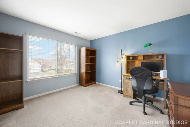 a view of workspace with furniture and a window