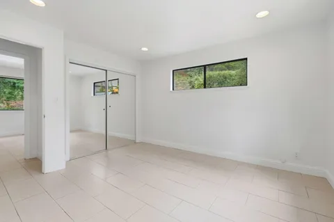 an empty room with closet area