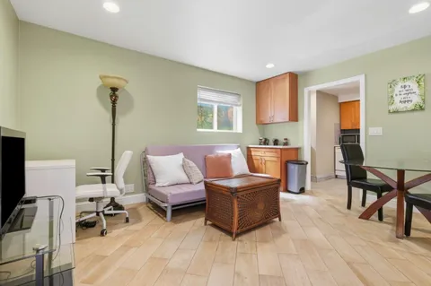 a kitchen with a stove microwave and sink