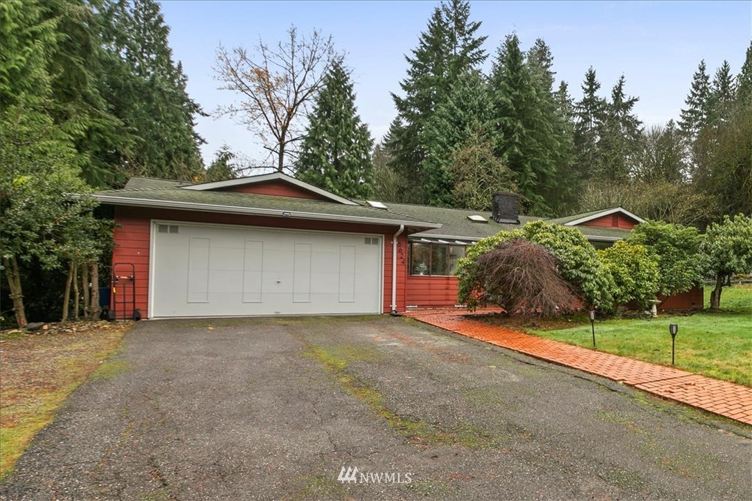 5624 227th Street Southeast Bothell, WA 98021 - Photo 1 of 24 a view of a house with a yard and garage