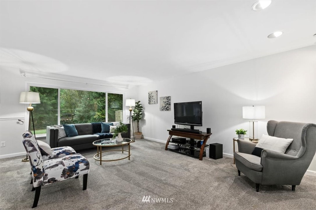 5624 227th Street Southeast Bothell, WA 98021 - Photo 2 of 24 a living room with furniture and a flat screen tv