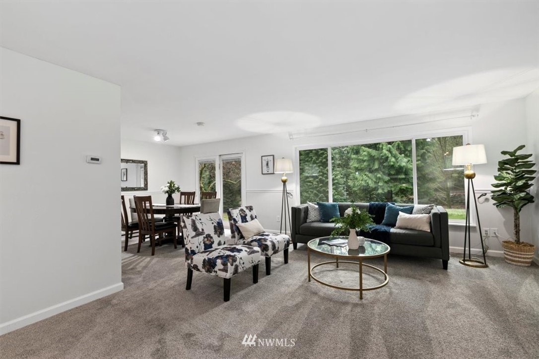 5624 227th Street Southeast Bothell, WA 98021 - Photo 3 of 24 a living room with furniture and a large window