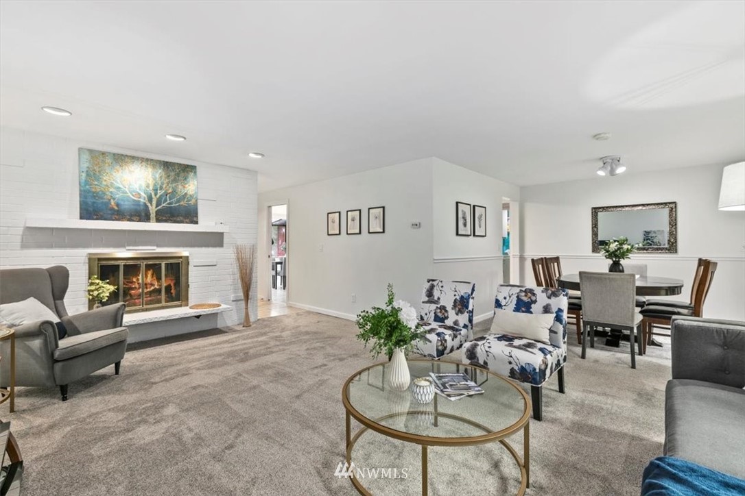 5624 227th Street Southeast Bothell, WA 98021 - Photo 5 of 24 a living room with furniture potted plant and a fireplace