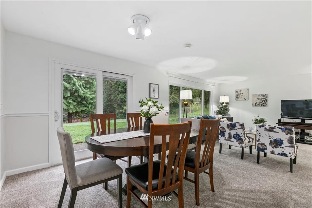 5624 227th Street Southeast Bothell, WA 98021 - Photo 7 of 24 a view of a dining room with furniture window and outside view