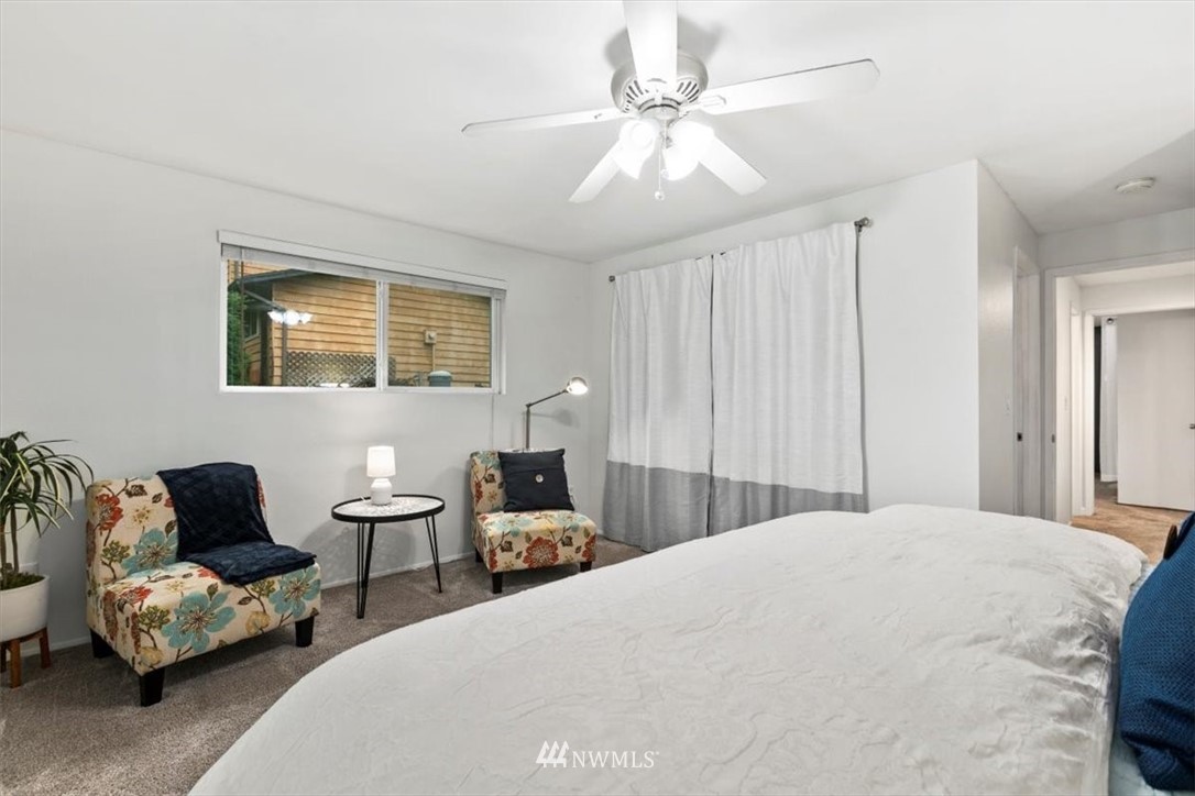5624 227th Street Southeast Bothell, WA 98021 - Photo 9 of 24 a bedroom with a bed and wooden floor