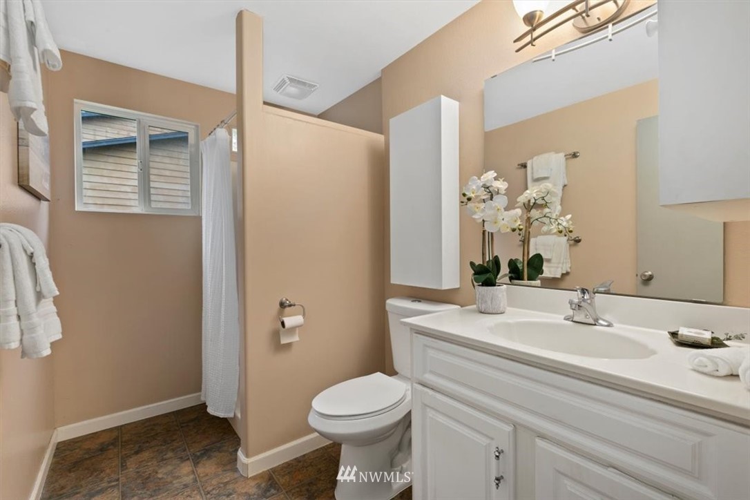 5624 227th Street Southeast Bothell, WA 98021 - Photo 10 of 24 a bathroom with a sink toilet and vanity