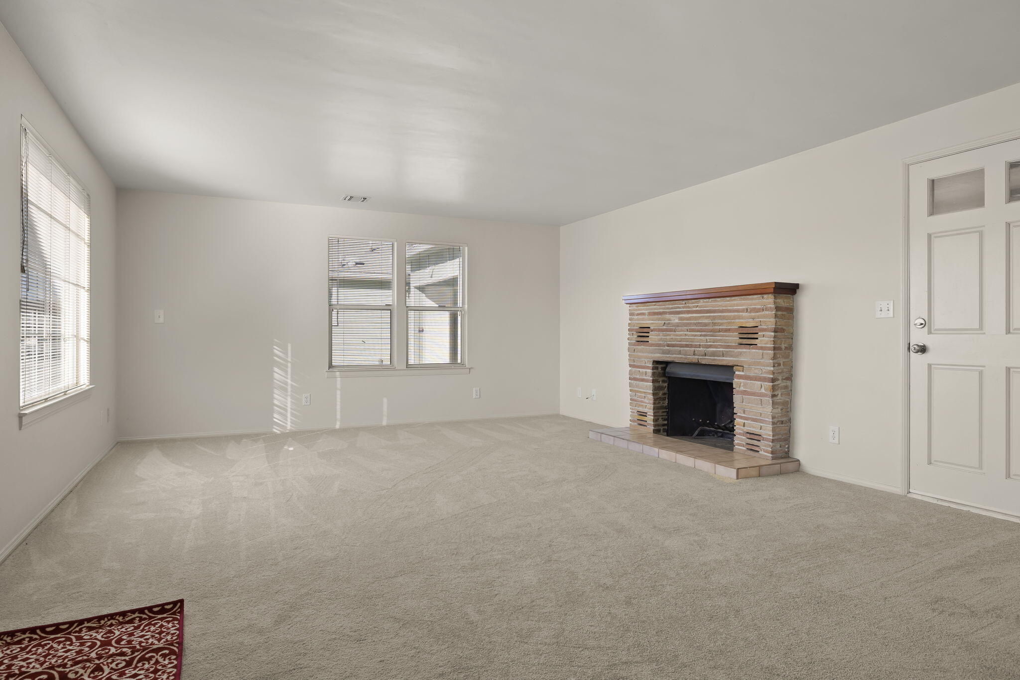 248 Old Grade Road Oak View, CA 93022 - Photo 8 of 41 an empty room with windows and fireplace