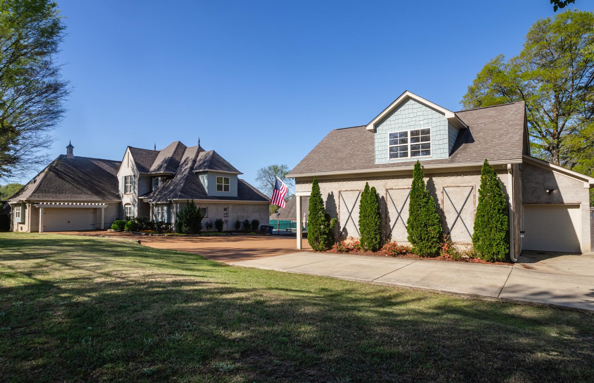 5309 Evergreen Road Lakeland, TN 38002 - Photo 1 of 40 View of front of property featuring driveway, a front yard, and brick siding