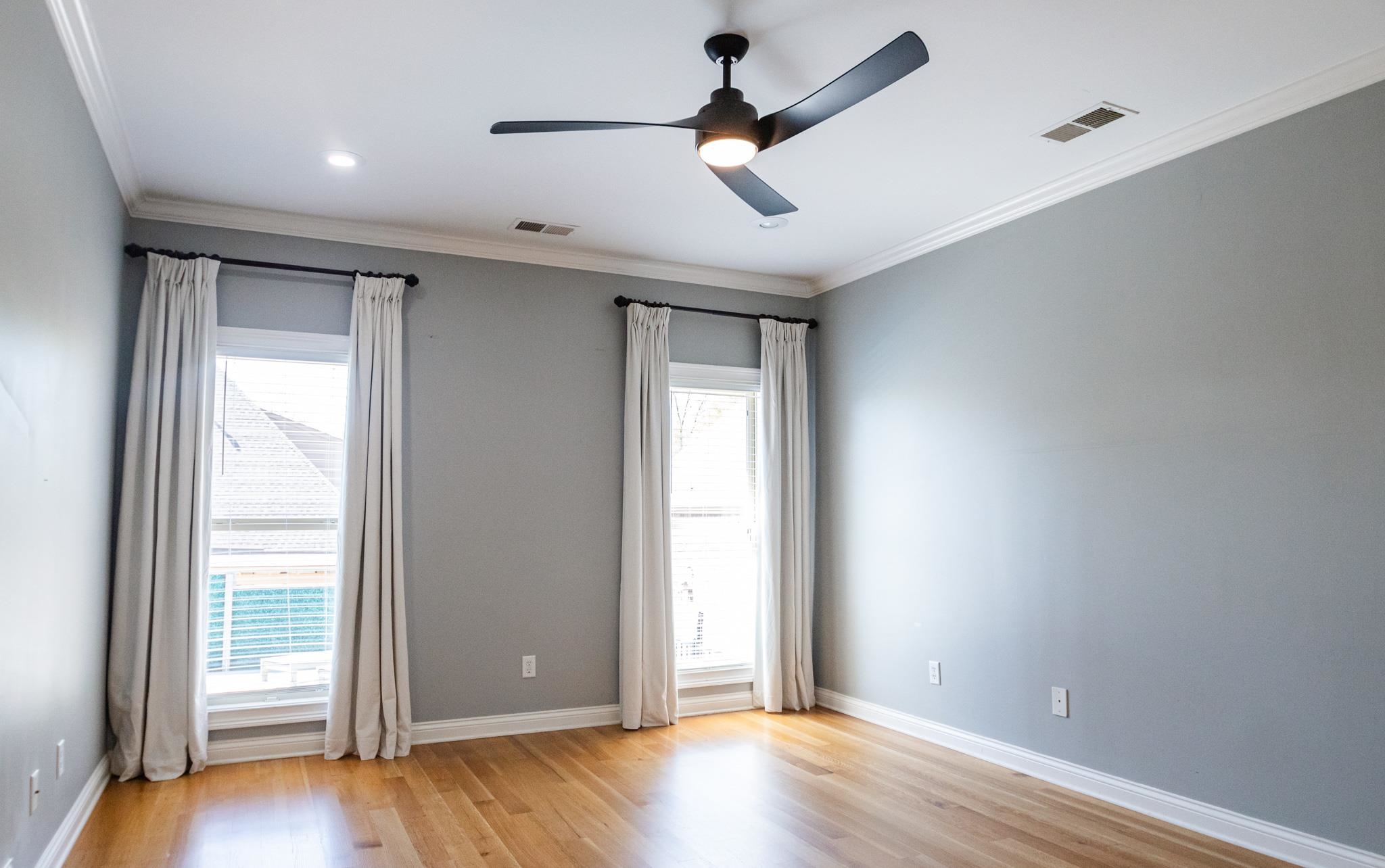 5309 Evergreen Road Lakeland, TN 38002 - Photo 16 of 40 Unfurnished room with visible vents, light wood-type flooring, ornamental molding, and ceiling fan
