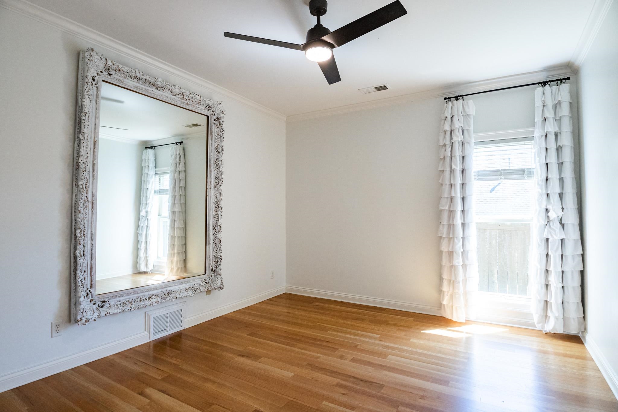 5309 Evergreen Road Lakeland, TN 38002 - Photo 23 of 40 Spare room featuring baseboards, ornamental molding, a ceiling fan, visible vents, and wood finished floors