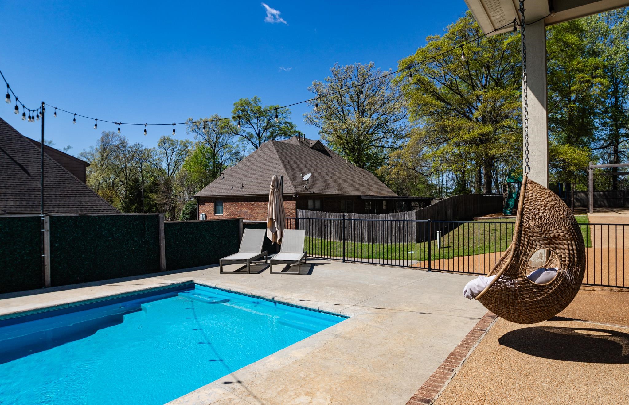 5309 Evergreen Road Lakeland, TN 38002 - Photo 3 of 40 View of swimming pool with a patio, a fenced in pool, and fence
