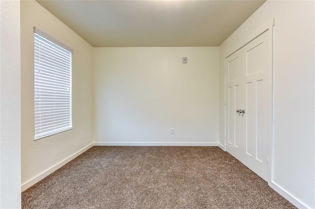 12603 Telge Road, Unit 4B Cypress, TX 77429 - Photo 8 of 16 an empty room with a window