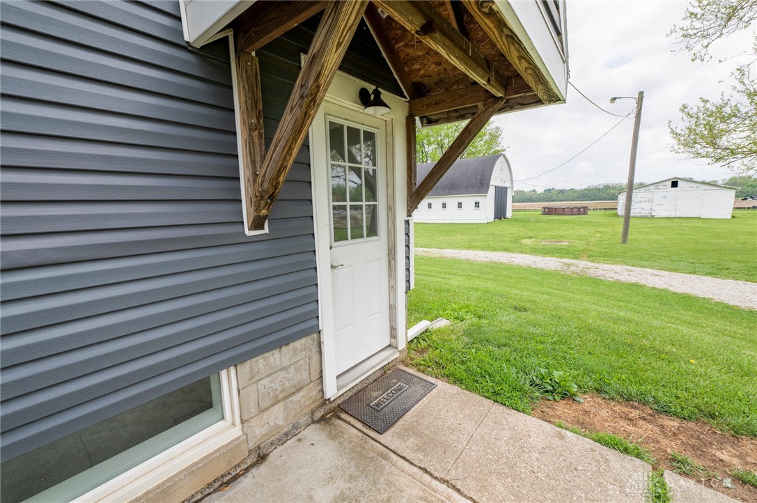 190 Swailes Road Troy, OH 45373 - Photo 60 of 82 This charming home features durable vinyl siding and a quaint entry, perfect for rural living.
