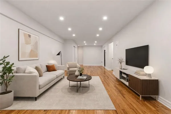a living room with furniture and a flat screen tv