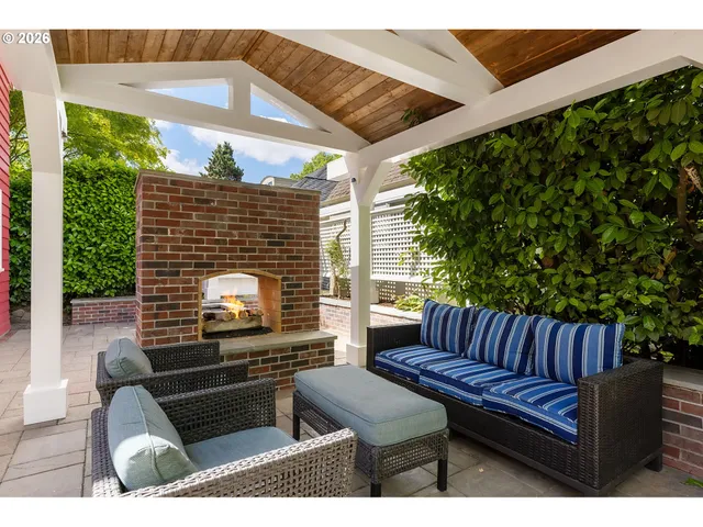 a view of a patio with table and chairs and potted plants