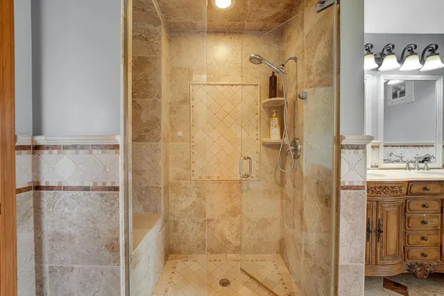 a bathroom with a shower and a sink