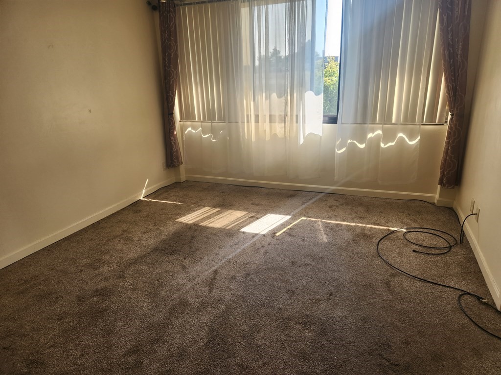70 Southbridge Street, Unit 302 Worcester, MA 01608 - Photo 18 of 22 a view of an empty room with a window