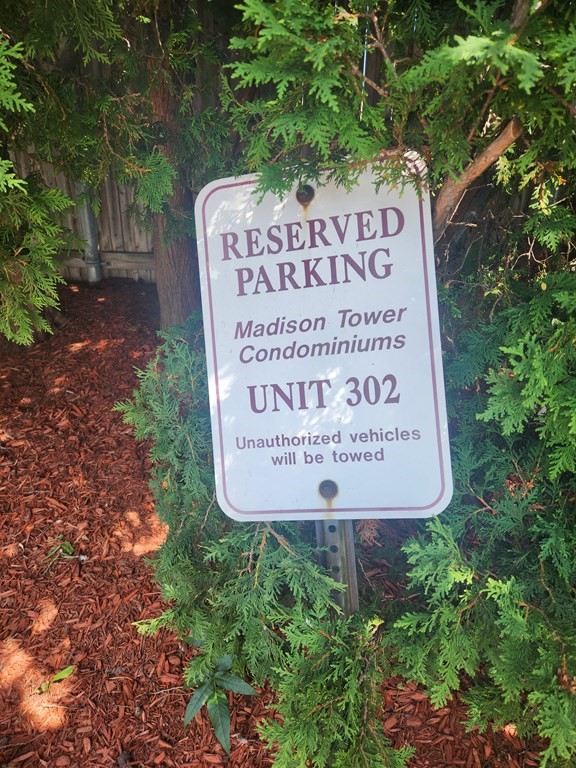 70 Southbridge Street, Unit 302 Worcester, MA 01608 - Photo 2 of 22 a sign on the side of the forest