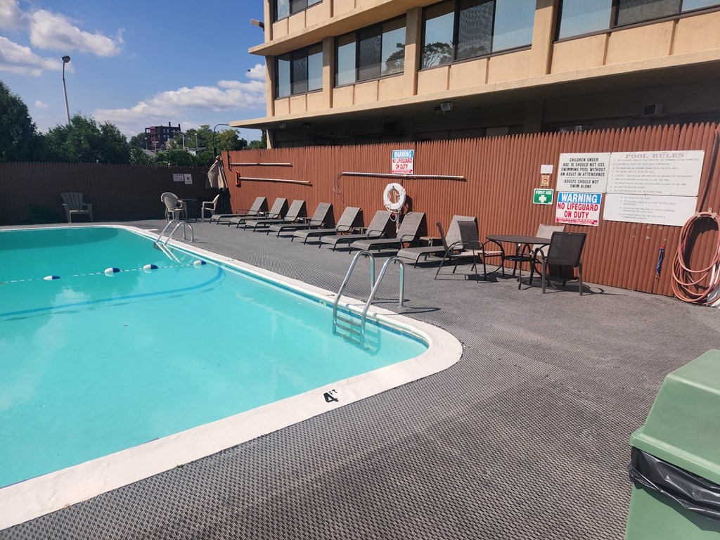 70 Southbridge Street, Unit 302 Worcester, MA 01608 - Photo 5 of 22 an outdoor space with seating area and trees in the background