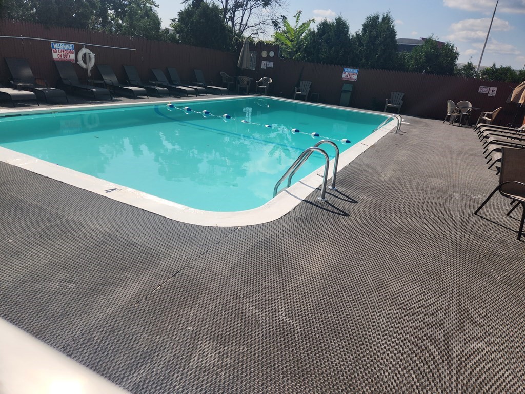 70 Southbridge Street, Unit 302 Worcester, MA 01608 - Photo 6 of 22 a view of a swimming pool with a yard