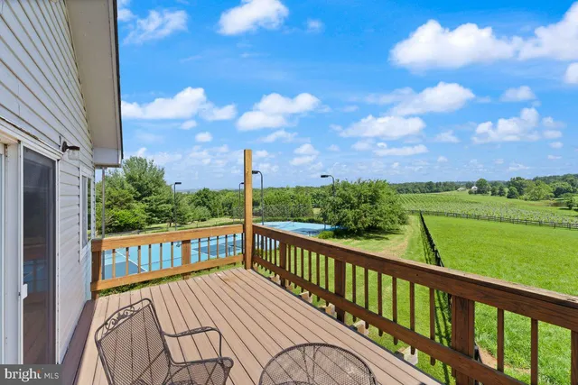 a view of a balcony with wooden floor