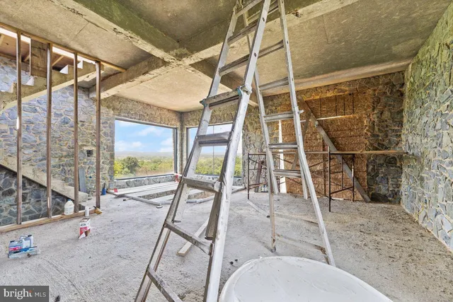 a room with pool table and glass door
