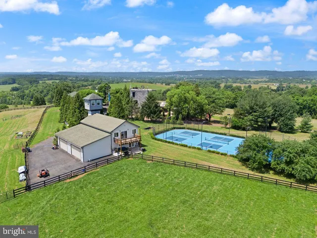 a view of a garden with houses