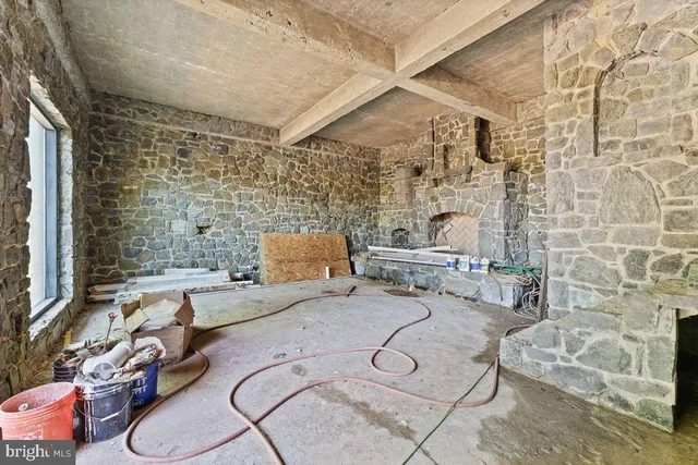 a view of a balcony with lake view and a floor to ceiling window next to a yard