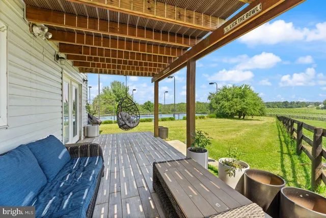 a view of a big yard with a house in the background